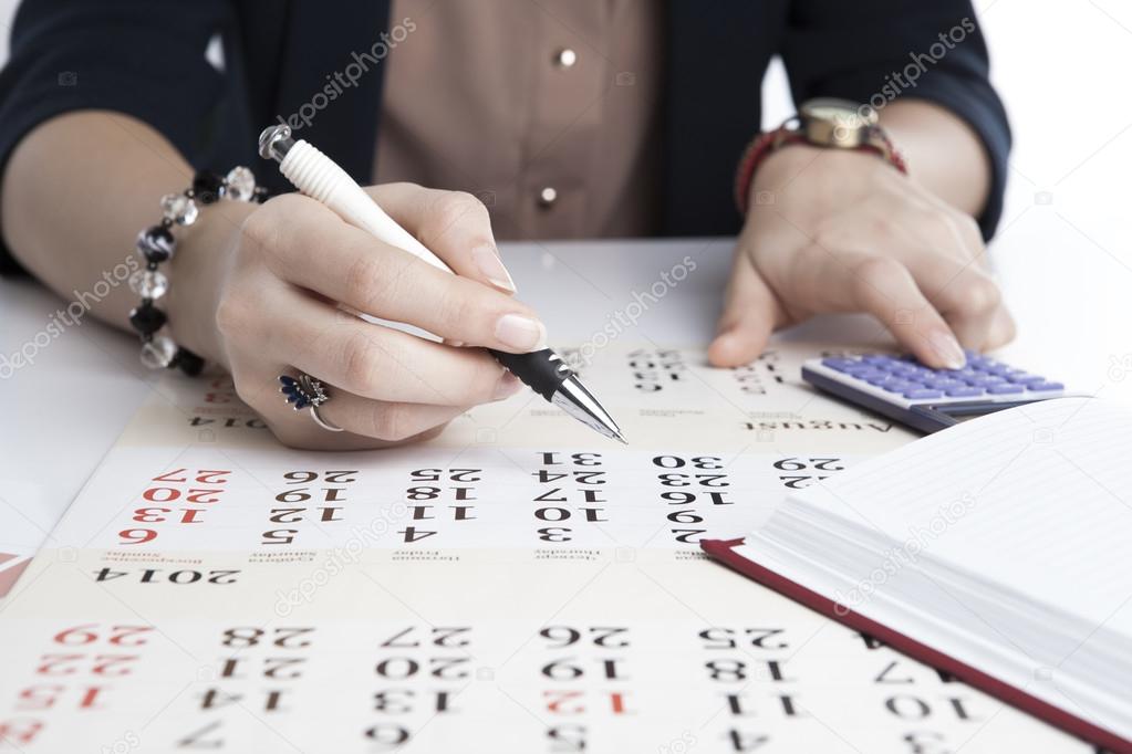 woman calculates future plans