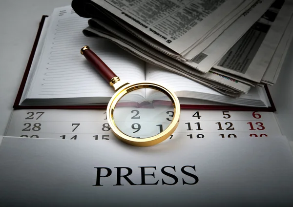 Magnifier and sign the press — Stock Photo, Image