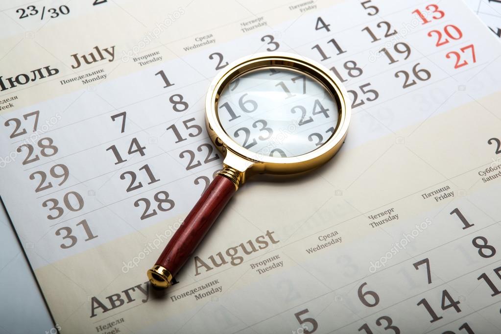 magnifier lying on the calendar