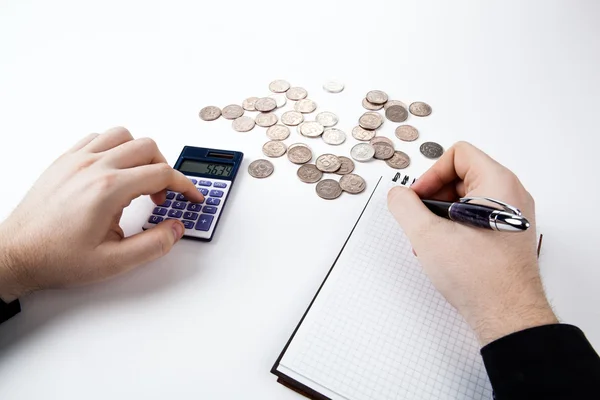 Man counts budget on a white — Stock Photo, Image