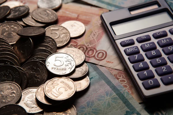 Handful of Russian rubles with calculator — Stock Photo, Image