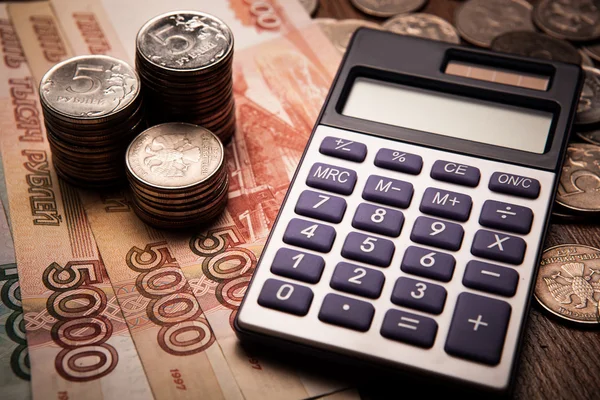 Handful of Russian rubles with calculator — Stock Photo, Image