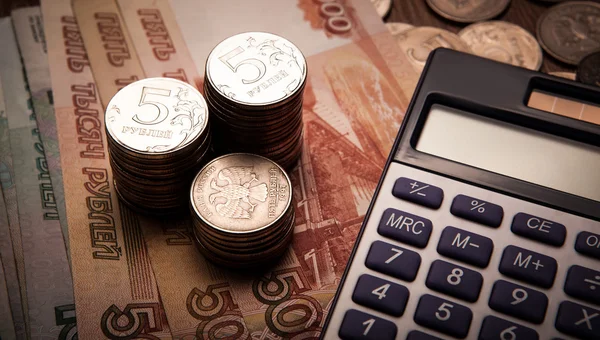 Handful of Russian rubles with calculator — Stock Photo, Image