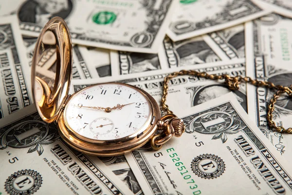 Złoty zegarek i Dolar rachunki — Zdjęcie stockowe