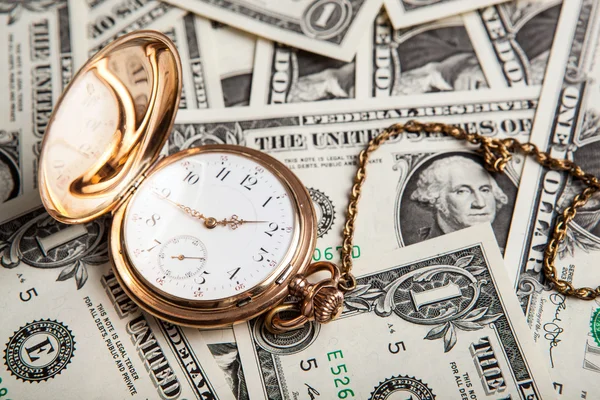 Reloj de oro y billetes de dólar — Foto de Stock