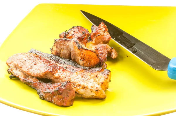 Delicious Barbecue and Knife in dish — Stock Photo, Image