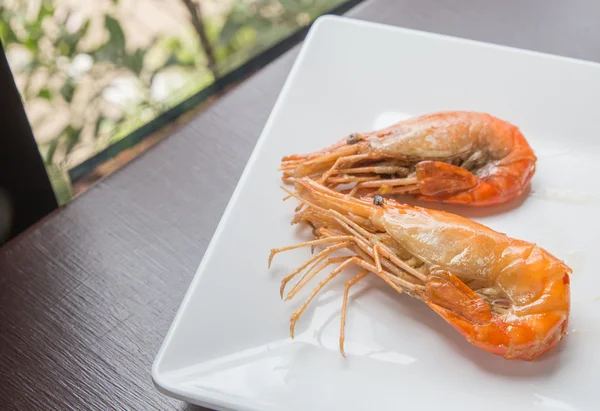 Two shrimp in white plate — Stock Photo, Image