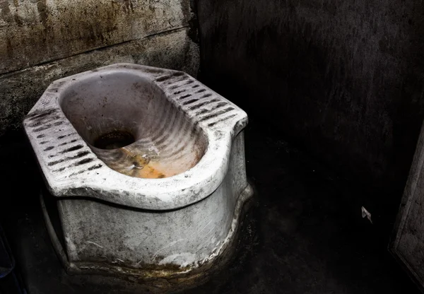 Dirty squat type toilet — Stock Photo, Image