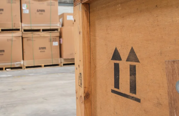 Arrow up icon on wooden board  in the warehouse — Stock Photo, Image