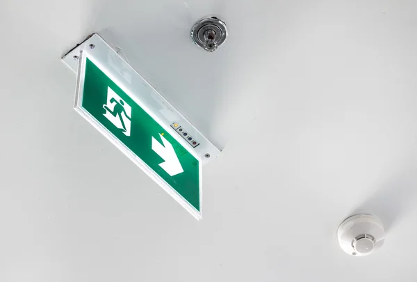 Emergency exit sign, cube light on ceiling, concept — Stock Photo, Image