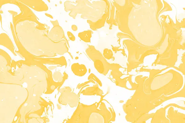 Sarı mermer arkaplan boya sıçrama deseni ile