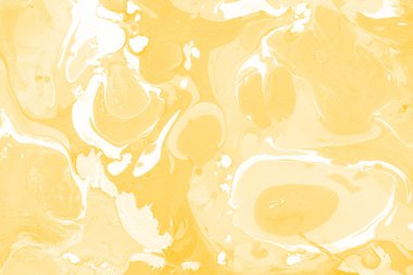 Sarı mermer arkaplan boya sıçrama deseni ile