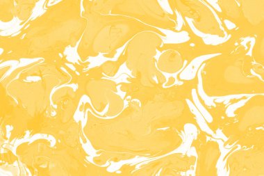 Sarı mermer arkaplan boya sıçrama deseni ile