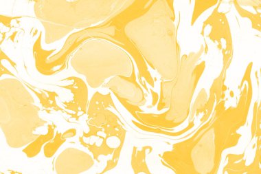 Sarı mermer arkaplan boya sıçrama deseni ile
