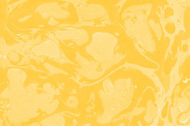 Sarı mermer arkaplan boya sıçrama deseni ile