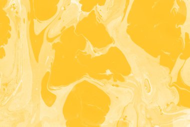 Sarı mermer arkaplan boya sıçrama deseni ile