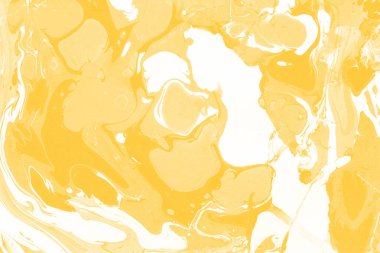 Sarı mermer arkaplan boya sıçrama deseni ile