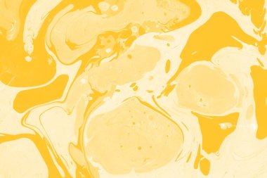 Sarı mermer arkaplan boya sıçrama deseni ile