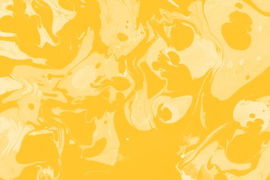 Sarı mermer arkaplan boya sıçrama deseni ile