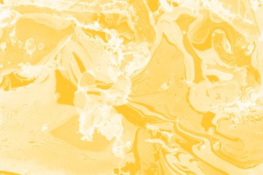 Sarı mermer arkaplan boya sıçrama deseni ile