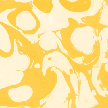 Sarı mermer arkaplan boya sıçrama deseni ile