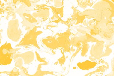 Sarı mermer arkaplan boya sıçrama deseni ile