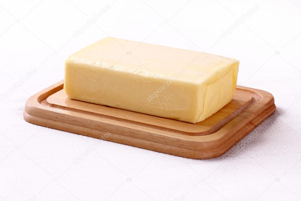 butter on wooden plate