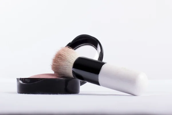 Cosmetics brush resting a blusher — Stock Photo, Image