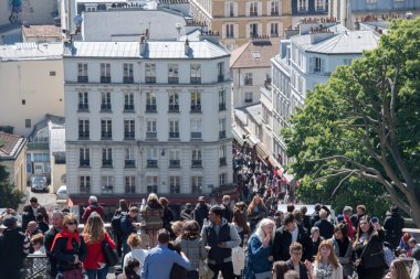 PARIS, FRANCE - MAY 1 2016 - Montmartre stairway crowded of people for sunday sunny day