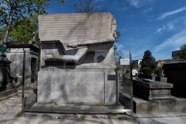 PARIS, FRANCE - MAY 2, 2016:  Alphonse Daudet la chevre de monsieur seguin author grave in Pere-Lachaise cemetery homeopaty founder clipart