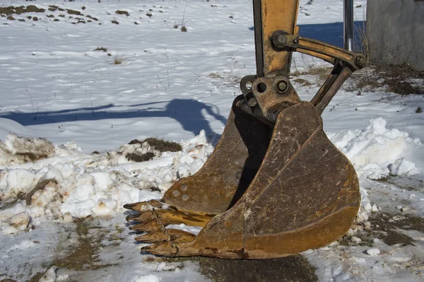 Rusted bucket on snow background — Stock Photo, Image