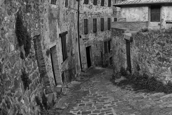 San quirico medieval casas parede de pedra — Fotografia de Stock