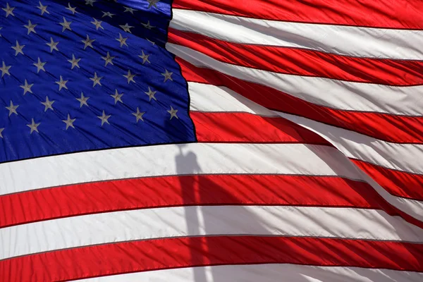 EE.UU. estrellas de la bandera americana tejiendo ion ciudad de Nueva York — Foto de Stock