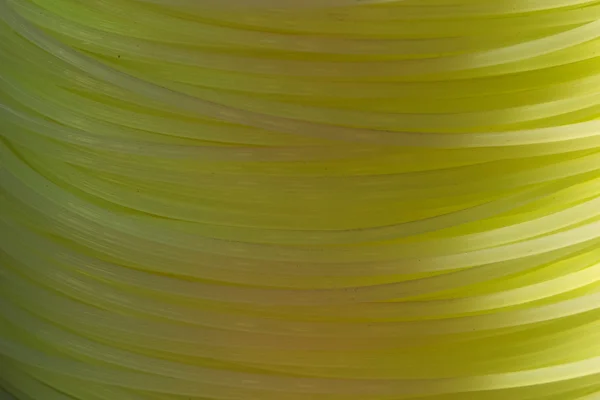 Fio de nylon amarelo fechar — Fotografia de Stock
