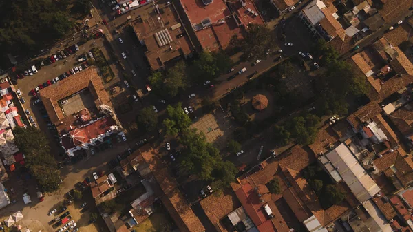 Aerial photography of Villa del Carbn, State of Mexico, distinguishes trees, cultivated lands, the town, houses, the main church, the streets and some cars.