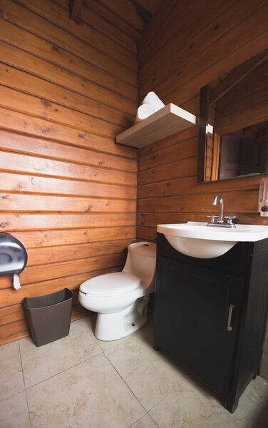 Bathroom of a wooden cabin, with a rustic appearance but at the same time modern and elegant.