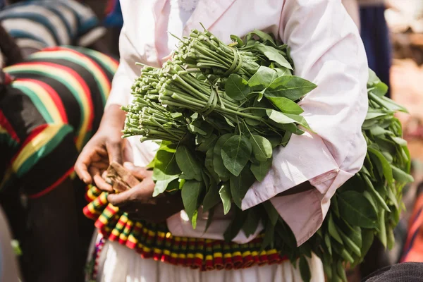 woman  takes part at the weekly market