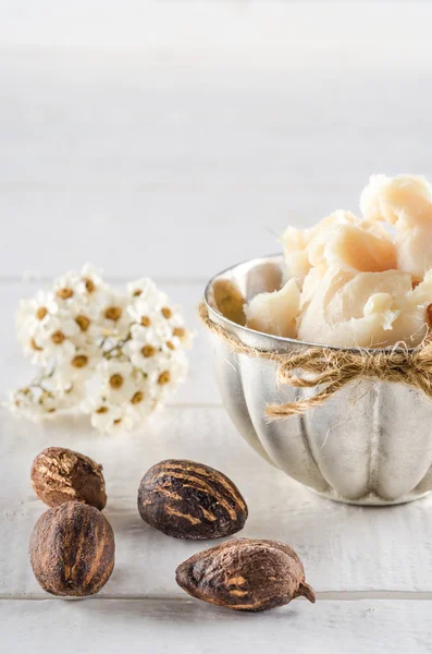 Shea butter and nuts — Stock Photo, Image