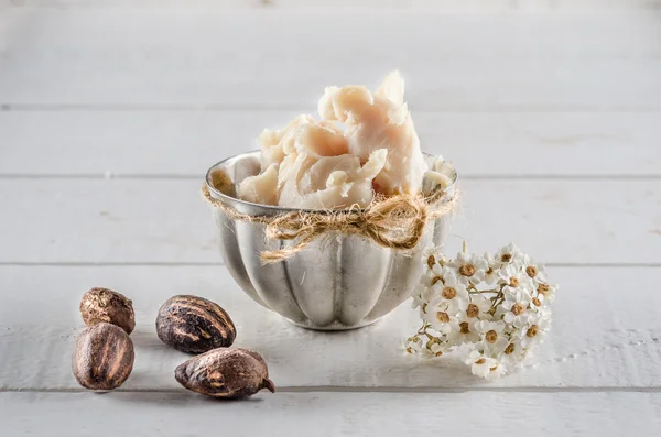 Shea butter and nuts — Stock Photo, Image