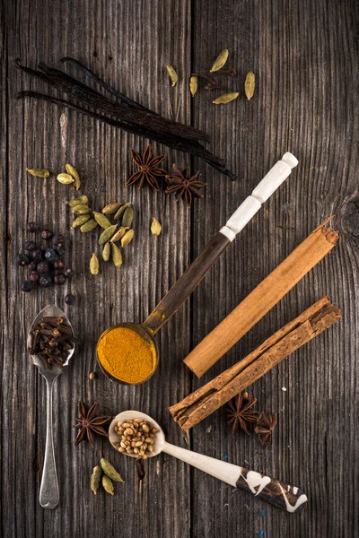 Different spices in spoons on table — Stock Photo, Image