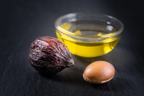 Argan Nuts and seed with oil — Stock Photo, Image