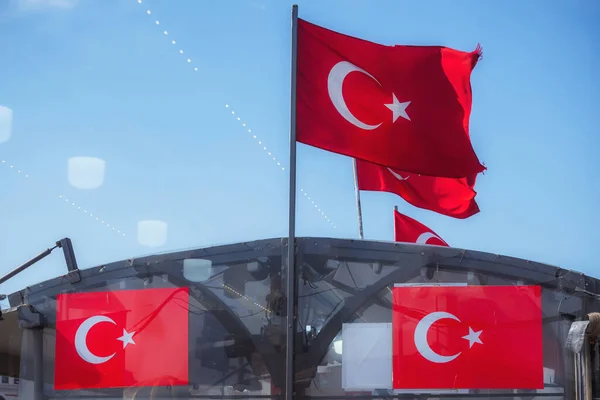 Turkish flags on the ferry in Istanbul. Turkish flag on a ship against a blue sky