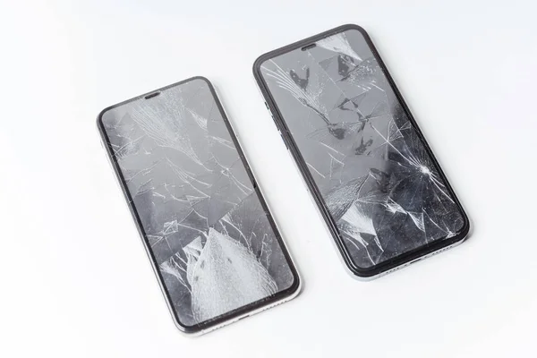 Two Broken Smartphones White Background Crash Protective Tempered Glass Smartphone — Stock Photo, Image