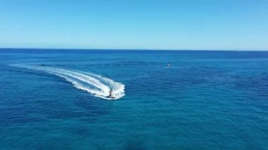 Aerial view of a jet ski boat in a deep blue colored sea, Zakynthos, Greece
