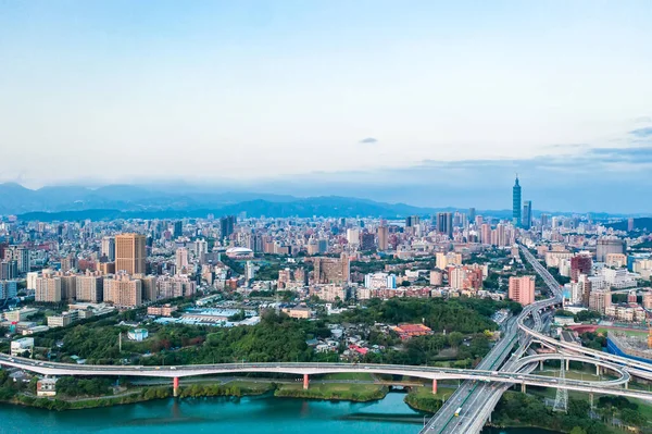 Taipei City Aerial View Asia business concept image, panoramic modern cityscape building birds eye view under sunrise and morning blue bright sky, shot in Taipei, Taiwan