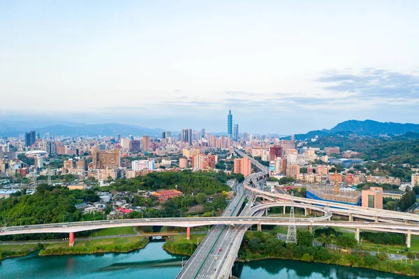 Taipei City Aerial View Asia business concept image, panoramic modern cityscape building birds eye view under sunrise and morning blue bright sky, shot in Taipei, Taiwan