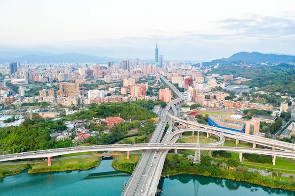 Taipei City Aerial View Asia business concept image, panoramic modern cityscape building birds eye view under sunrise and morning blue bright sky, shot in Taipei, Taiwan
