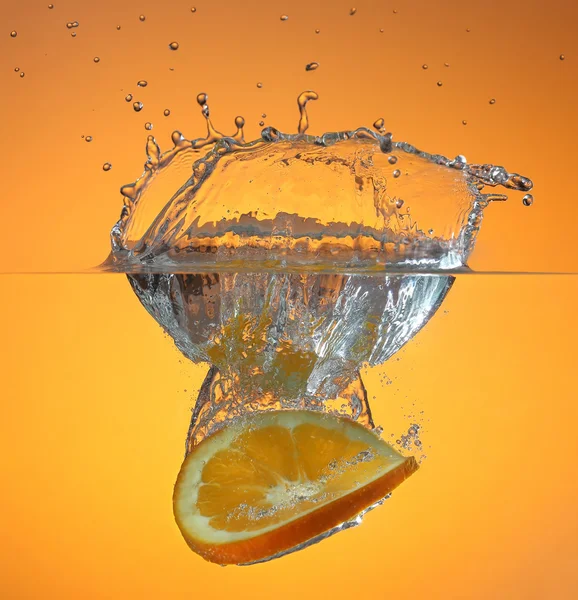 Orange in water splash Stock Photo