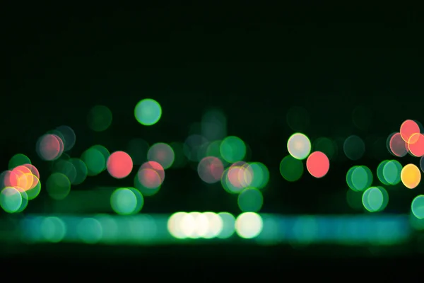 Bokeh colored lights on black background — Stock Photo, Image