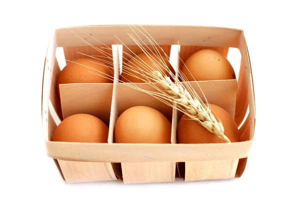 Fresh eggs in wicker basket — Stock Photo, Image